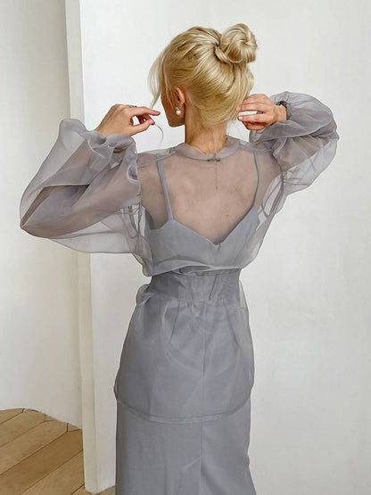 Chemisier sexy transparent à col en V et manches longues bouffantes avec nœud papillon