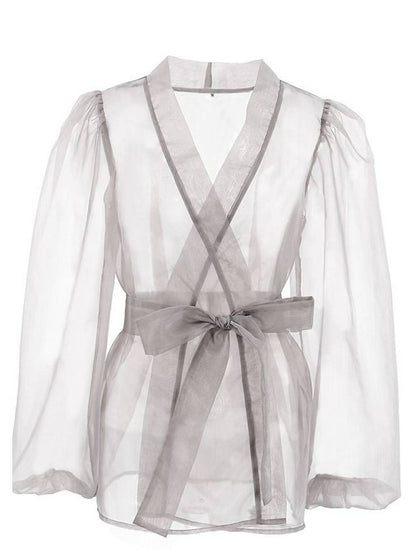 Chemisier sexy transparent à col en V et manches longues bouffantes avec nœud papillon
