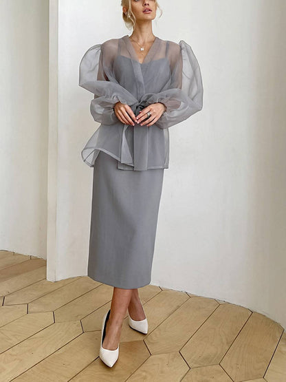Chemisier sexy transparent à col en V et manches longues bouffantes avec nœud papillon