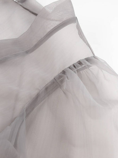 Chemisier sexy transparent à col en V et manches longues bouffantes avec nœud papillon