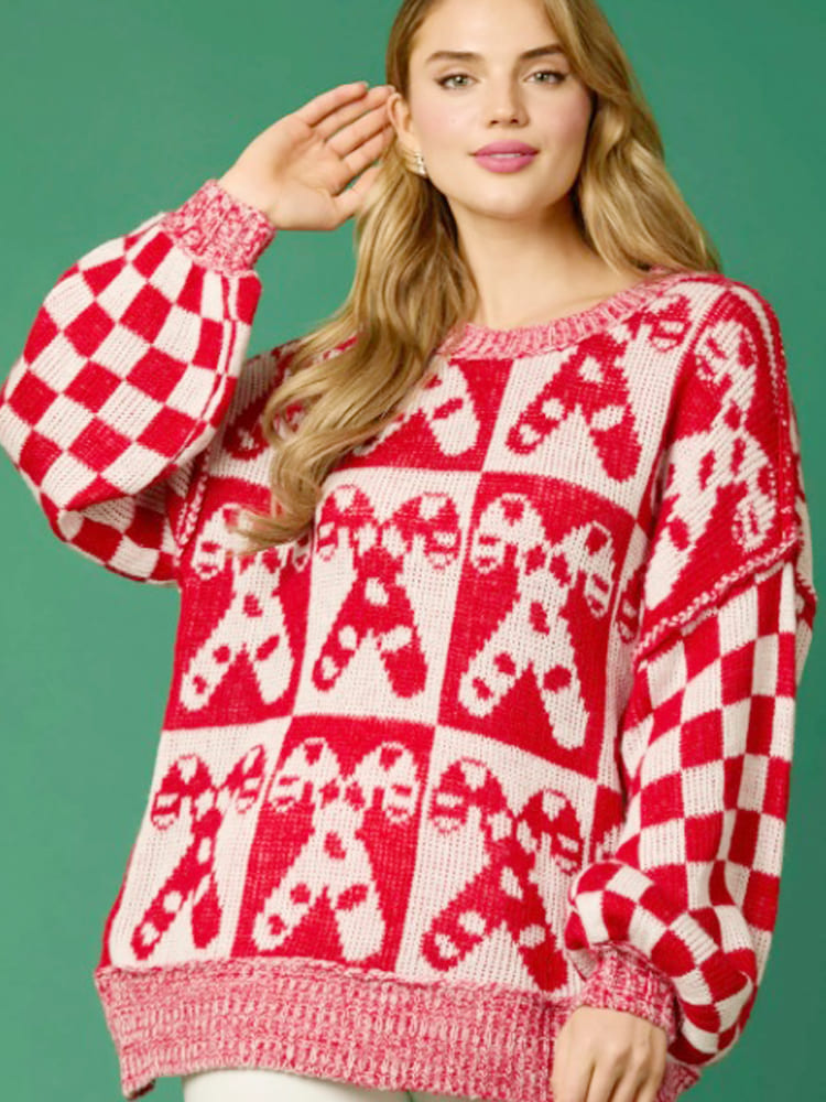 Pull de Noël en tricot avec motif canne à sucre
